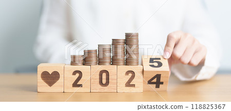 2024 end year to Happy New Year 2025 with Doctor, heart shape and coins stack. Money for Healthcare cost, Money Saving, Health Insurance, Medical, Donation and Financial concept 118825367