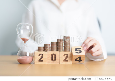2024 end year to Happy New Year 2025 with hourglass and coins stack arrangement. Money Saving for Future Plan, Retirement fund, Pension, Investment, Wealth Business, Financial and countdown concepts 2024 end year to Happy New Year 2025 with hourglass and coins stack arrangement. Money Saving for Future Plan, Retirement fund, Pension, Investment, Wealth Business, Financial and countdown concepts 118825369