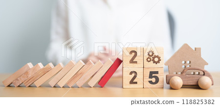 2025 year with wood block falling to business icon with Home and Car model. Real estate Mortgage, House loan and Car debt, Interest rate, risk management, Insurance and economic recession 2025 year with wood block falling to business icon with Home and Car model. Real estate Mortgage, House loan and Car debt, Interest rate, risk management, Insurance and economic recession 118825382
