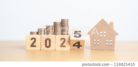 2024 end year to Happy New Year 2025 with house model and Coins stack. real estate, Home loan, tax, investment, mortgage, financial, savings and New Year Resolution concepts 2024 end year to Happy New Year 2025 with house model and Coins stack. real estate, Home loan, tax, investment, mortgage, financial, savings and New Year Resolution concepts 118825410