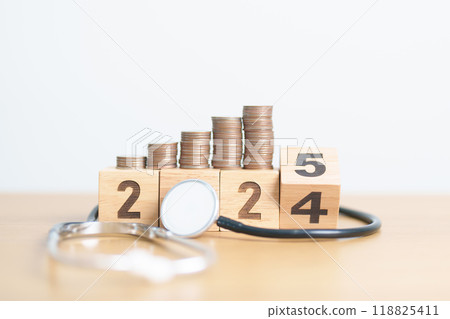 Happy New Year 2025 with doctor Stethoscope, coins stack and red heart on table. health care, Money saving, Goal, Resolution, health Insurance, Wellness and medical concept Happy New Year 2025 with doctor Stethoscope, coins stack and red heart on table. health care, Money saving, Goal, Resolution, health Insurance, Wellness and medical concept 118825411