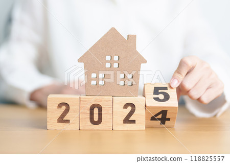 2024 end year to Happy New Year 2025 with house model. real estate, Home loan and mortgage, tax, investment, financial, savings and New Year Resolution concepts 2024 end year to Happy New Year 2025 with house model. real estate, Home loan and mortgage, tax, investment, financial, savings and New Year Resolution concepts 118825557