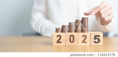Happy New Year 2025 with Coins stack. Money, Budget, tax, investment, financial, savings and New Year Resolution concepts Happy New Year 2025 with Coins stack. Money, Budget, tax, investment, financial, savings and New Year Resolution concepts 118825578