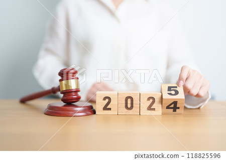 2024 end year to Happy New Year 2025 with judge gavel on table. Law, lawyer, judgment, justice auction and bidding concept 118825596