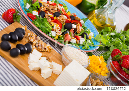 Ingredients for salad from arugula and vegetables Ingredients for salad from arugula and vegetables 118826732
