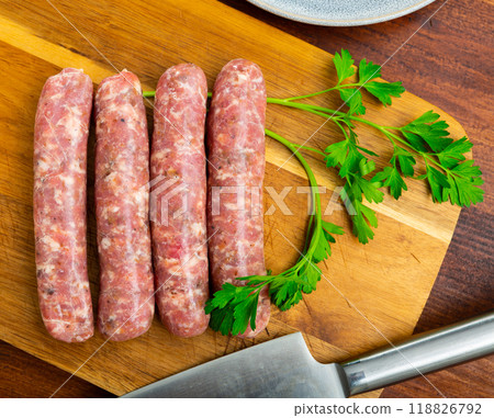 Delicious butifarra from minced meat on wooden surface, pork sausage with mushrooms 118826792