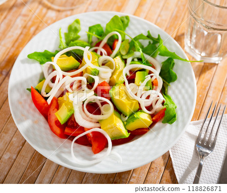 Vegetarian salad from avocado with tomatoes, onions, greens 118826871