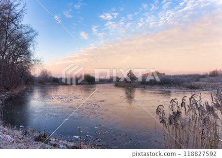 Serene Winter Landscape with Frozen River 118827592