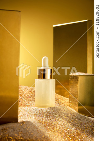 The promotional photo of high-end cosmetic advertisement, cosmetic mockup bottle placed on sand, which has golden twinkle dust sprinkled on. Side view, space for text 118829603