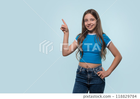 Girl confidently pointing upwards, indicating an idea. 118829784