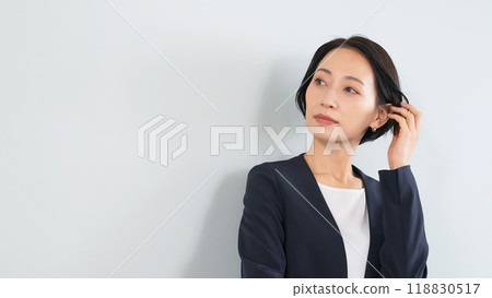Female business person brushing her hair 118830517