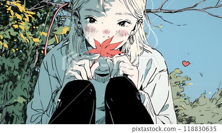 一位年輕女子撿起彩色的秋葉 118830635