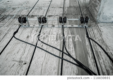 Cables in an elevator shaft at a new building construction site Cables in an elevator shaft at a new building construction site 118830691