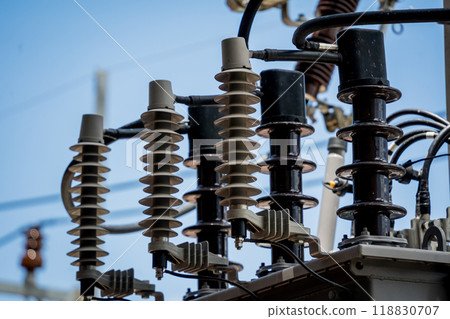 Various electrical equipment is set against a bright blue sky 118830707