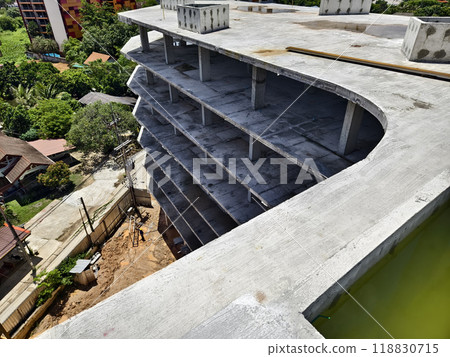 Large building with a roof pool of water under construction 118830715