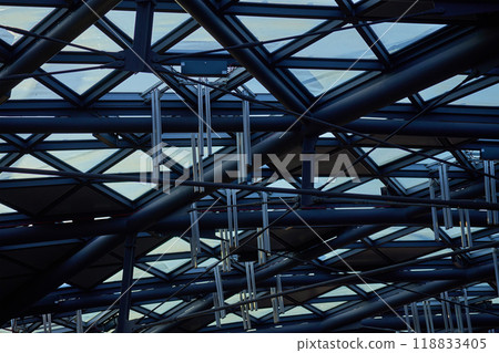 Modern building ceiling composed of metal beams and glass panels. Contemporary architecture elements 118833405