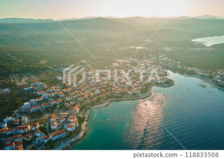 Aerial view of Adriatic sea coastline with coastal village and boats along shoreline. Panorama of tourist town Rogoznica in Croatia on Adriatic Sea. Summer travel concept Aerial view of Adriatic sea coastline with coastal village and boats along shoreline. Panorama of tourist town Rogoznica in Croatia on Adriatic Sea. Summer travel concept 118833508