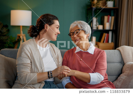 mother and her adult daughter 118833879