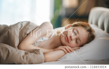 child is sleeping in the bed child is sleeping in the bed 118833914