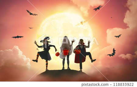 children in carnival costumes at Halloween 118833922