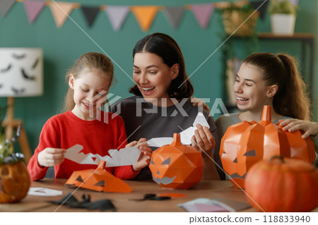 Happy family preparing for Halloween. Happy family preparing for Halloween. 118833940