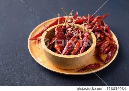 Dried red chili pepper in bowl on black background, Food ingredient Dried red chili pepper in bowl on black background, Food ingredient 118834084