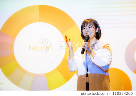 A woman giving a seminar in a white lab coat. Photo courtesy of Denpa Gakuen, Tokyo Electronics College. A woman giving a seminar in a white lab coat. Photo courtesy of Denpa Gakuen, Tokyo Electronics College. 118834260