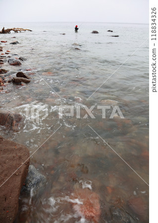 Fisherman Stones in sea water autumn Fisherman Stones in sea water autumn 118834326