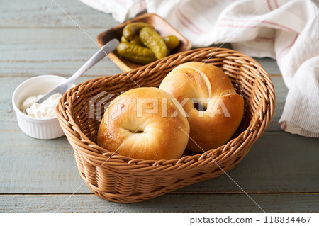 Freshly baked bagels in a basket Freshly baked bagels in a basket 118834467