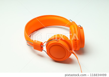 On-top, large, bright orange headphones, on a light background. On-top, large, bright orange headphones, on a light background. 118834499