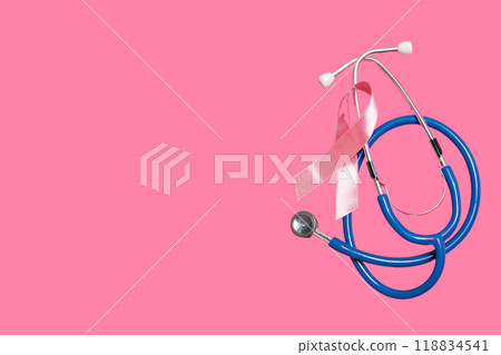 Stethoscope with pink ribbon on pink background Stethoscope with pink ribbon on pink background 118834541