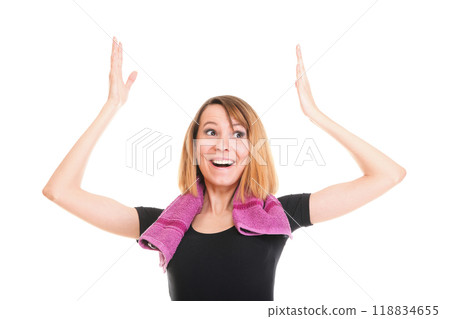 Fitness woman jumping excited isolated female smiling showing muscles 118834655