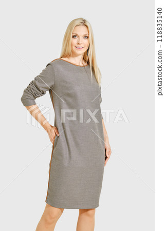Portrait of stylish woman in a knee-length houndstooth dress 118835140