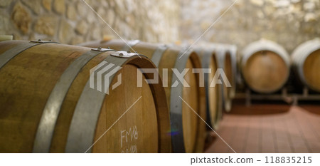 Wine cellar with oak barrels for aging wine. Traditional wine storage. Wine cellar with oak barrels for aging wine. Traditional wine storage. 118835215