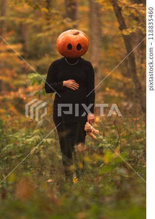 Surreal Pumpkin Head in Autumn Forest 118835460