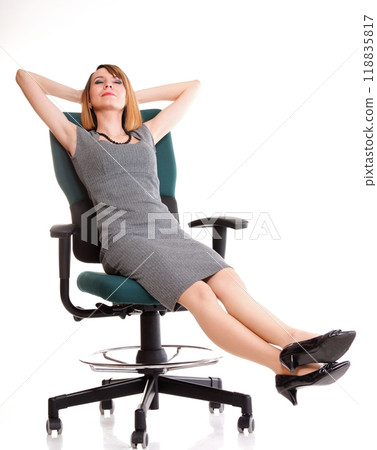 Full length business woman sitting on chair holding clipboard isolated 118835817