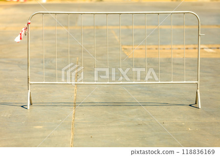 Road block standing on concrete. 118836169