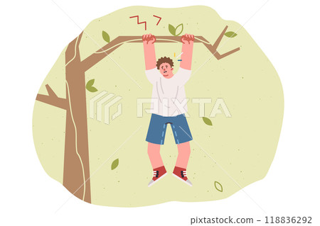 Teenage boy is at risk of falling from tree and getting injured, hanging on branch in need of help 118836292