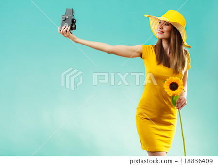 Summer woman holds sunflower old camera Summer woman holds sunflower old camera 118836409