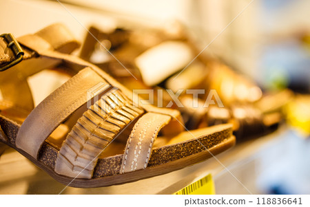 Sandals in row on shop shelf Sandals in row on shop shelf 118836641