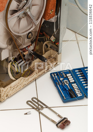 Washing machine during repair. 118836642