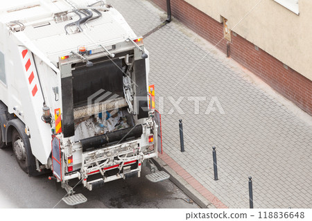 Garbage dustcart truck on city street 118836648