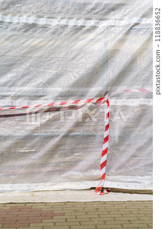 Hazard warning tape on construction site Hazard warning tape on construction site 118836652