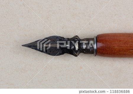 Fountain pen on an antique textured paper. 118836886