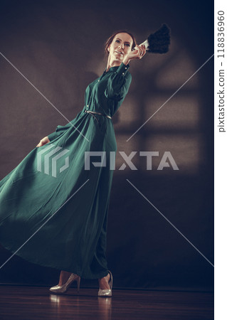 Vintage lady with feather fan on dark 118836960