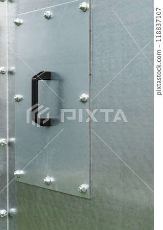 Close up of black plastic handle on metal 118837107