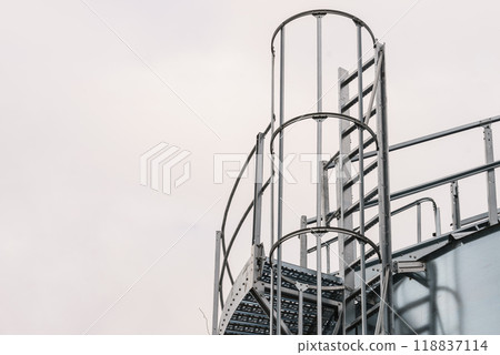 Industrial metal ladder with round railing 118837114