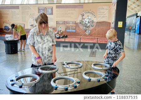 Educational Adventure for Kids at Valencia's Science Museum Featuring Innovative Displays and Interactive Experiences. Young Explorers Engaged in Interactive Learning at Valencia's Science Museum 118837535