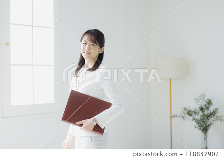 Woman in a white suit 118837902