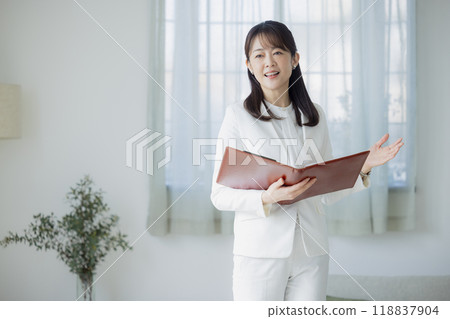 Woman in a white suit 118837904